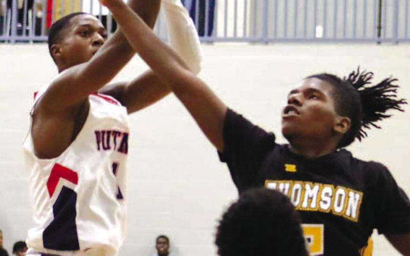 Eren Banks (1) shoots over defenders. ARELLA CASH/Staff