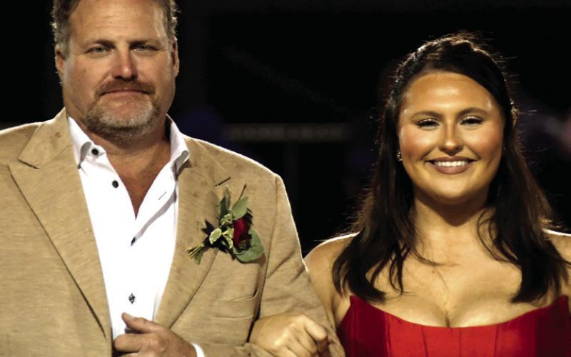 Tessa Watson is the daughter of Stephen Watson, who escorted her for Homecoming.