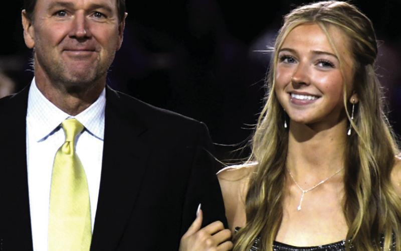 Samantha Redmon, daughter of David and Sherryl Redmon, was escorted by her father.
