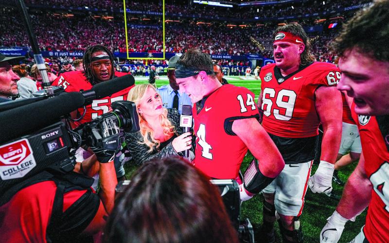 Georgia quarterback Gunner Stockton talks with ESPN reporter Holly Rowe following the Bulldogs’ 22-19 win over Texas in the 2024 SEC Championship game at Mercedes-Benz Stadium in Atlanta. COURTESY OF UGA ATHLETICS