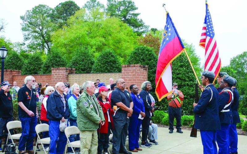 Members of the Putnam County Junior Reserve Officers Training Corps presented the nation’s colors Monday morning for Veterans Day at Putnam County Veterans Wall of Honor Park in downtown Eatonton. IAN TOCHER/Staff