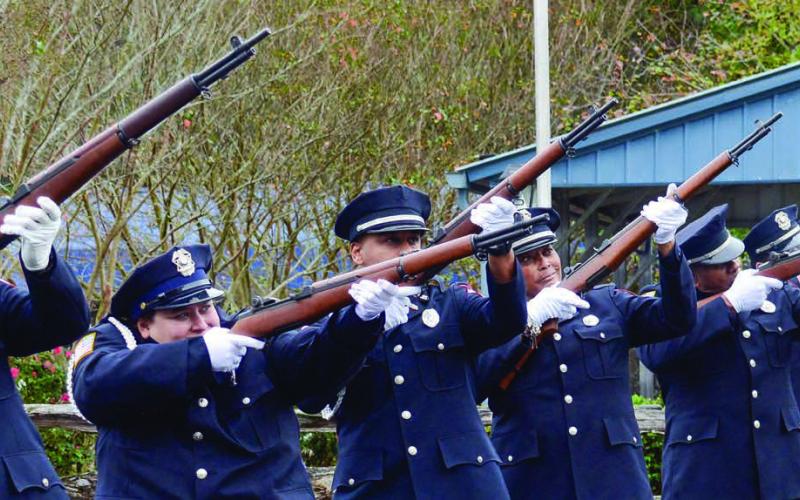 Members of the Eatonton Police Department Honor Guard shot three rounds of seven for a 21-gun salute to fallen veterans on Monday morning at the Putnam County Veterans Wall of Honor Park in Eatonton.  IAN TOCHER/Staff