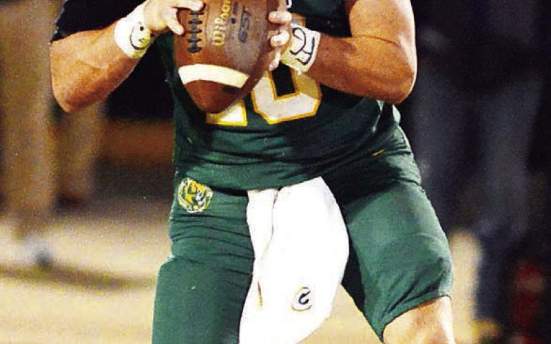 Senior quarterback Ames Johnson had a solid outing for Gatewood last Friday when the Gators visited Brentwood Academy in Sandersville. IAN TOCHER/File Photo