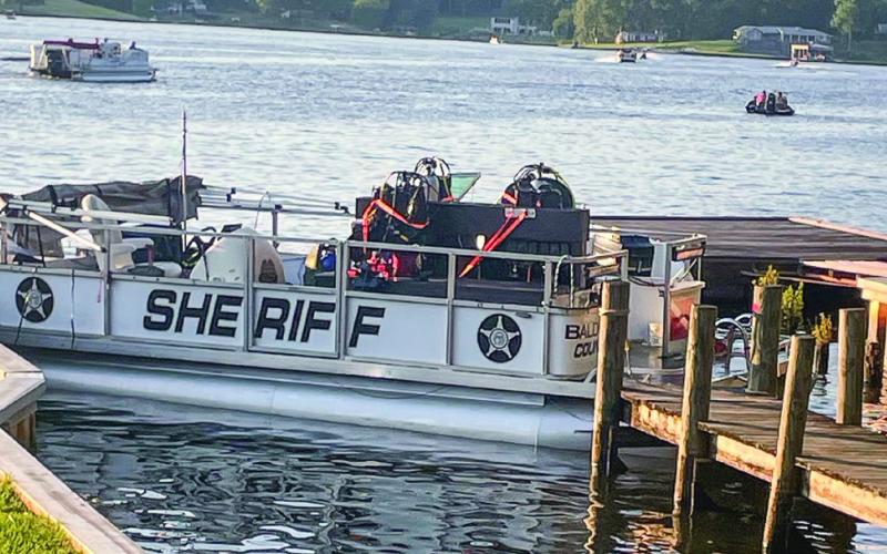Searchers and divers on the Baldwin County Sheriff’s Office boat return to the command post for a break Friday. LYNN HOBBS/Staff
