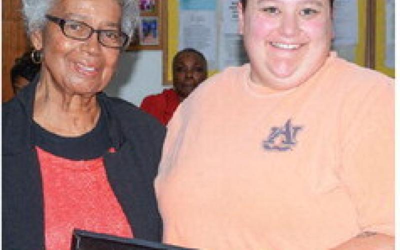 Georgia Benjamin-Smith (left) presented the first award of the night to Eatonton Police Department patrol officer Rebecca Meeks. IAN TOCHER/Staff