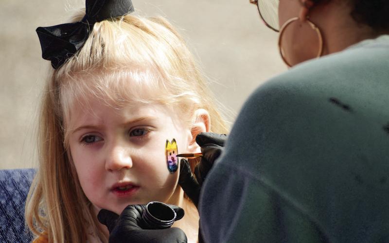 Local face painter Kelsie Merritt generously donated her time and materials to add plenty of color to the LP Egg Hunt. IAN TOCHER/Staff