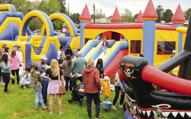 Kids had the choice of four bouncy houses from two big slides, an obstacle course, and a pirate ship. IAN TOCHER/Staff