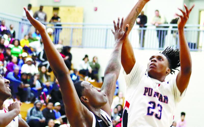 War Eagles’ senior Detravius Smith (12) shoots a jump shot over a Golden Hawks’ defender. He finished with a dozen points in the win. ARELLA CASH/Staff