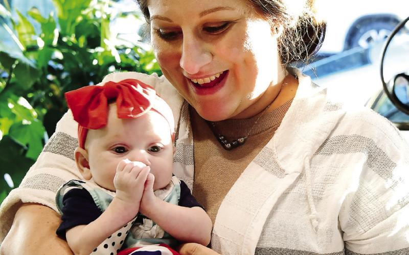 Georgia Writers Museum Executive Director Melissa Swindell recently introduced her 3-month-old daughter, Tabitha Blake, to downtown Eatonton, where both received plenty of love and admiration from friends and colleagues alike. IAN TOCHER/Staff