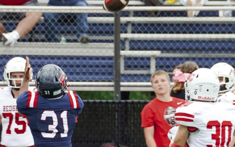 Putnam senior Bryce Brabham made this catch along the right sideline for a solid gain. IAN TOCHER/Staff