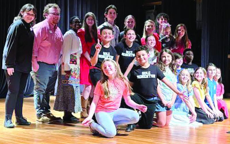 The talent and staff that made the Cocoa House possible come together after their final bow.