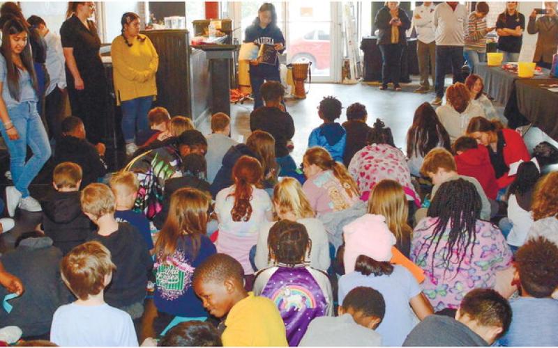Putnam High students line the edges of the room at the Live and Drive Book Fair they organized and presented March 10, at Georgia Writers Museum.