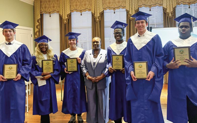 L-R: Eatonton Youth Leadership graduates John Van de Planque, Baylen Yarbrough, Colby Cash, Eatonton Councilwoman Janie Reid, Seth Harris Jr., Jake Rich, and Jay Terrell. EMME CLAUSE/Staff