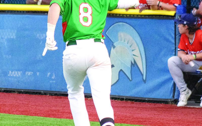 Wild Things’ third baseman Blake Bellflower celebrates as he rounds the bases after hitting a home run against the Astros.