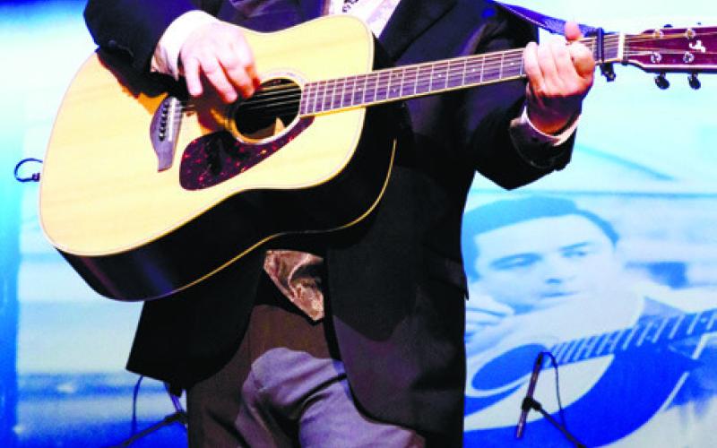 Actor playing Johnny Cash plays guitar. CONTRIBUTED