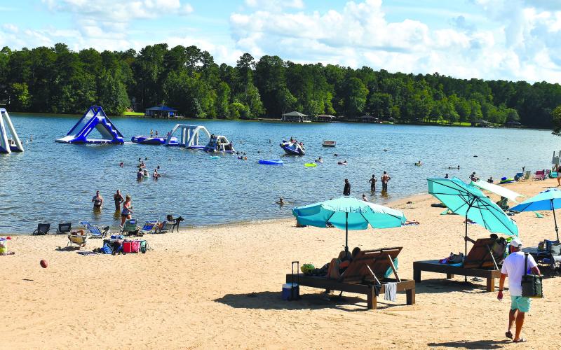 Labor Day weekend visitors to Oconee Springs Park enjoy a good time on the pet-friendly beach.