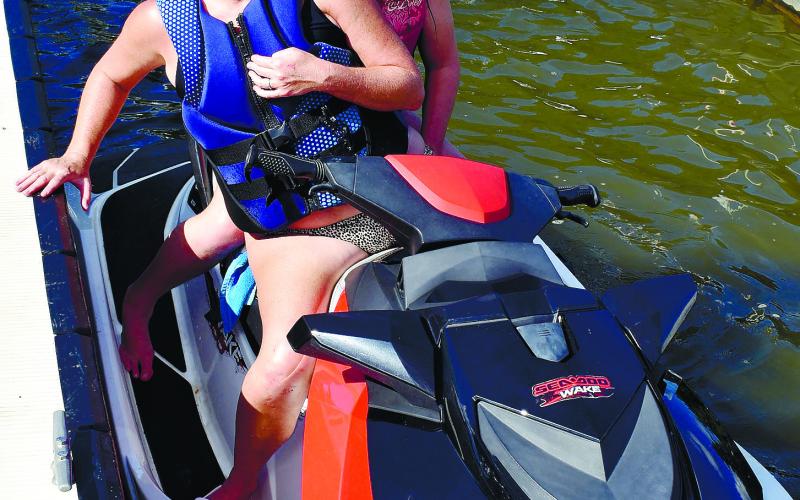 Shannon and Brooklyn Phillips are all smiles upon their return to Oconee Springs Park from a jet-ski ride.