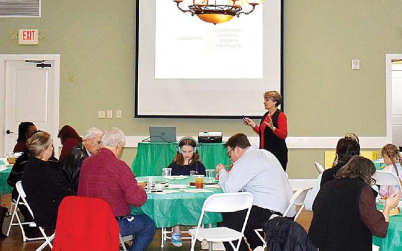 Several Putnam County citizens and representatives of local governmental and social assistance organizations were on hand as Rebekah Hudgins of the Georgia Family Connection Partnership gave her presentation. LENA HENSLEY/Staff