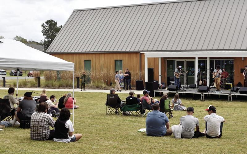 Colin Cutler and Hot Pepper Jam, of GCSU’s Music Department, Sally Jaye, and special guest Rob Sumowski played throughout the day on the stage set up in front of Andalusia Farm’s Interpretive Center. Attendees brought tents, blankets, and chairs to enjoy the day's festivities. BAILEY MCCULLY/Staff