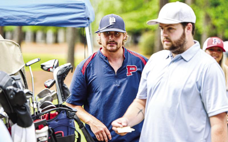 Putnam County assistant football coach Simon Petit helps participants before the start of last year’s tournament. CHARLES JORDAN/Staff