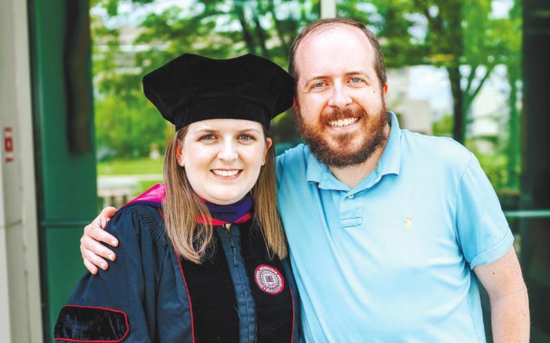 Graduate Sarah Lines Kay posing after receiving doctorate of jurisprudence degree from Indiana University Robert H. McKinney School of Law. CONTRIBUTED