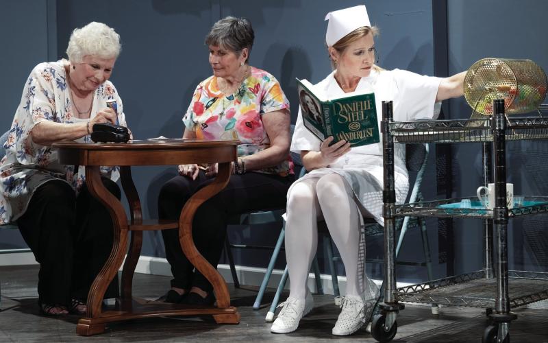 Ruby Sue Bennett (Kathy Wardlaw), an undercover FBI agent in the role of a nurse, calls the bingo numbers for the residents while recording a suspect. LEIGH LOFGREN/Staff