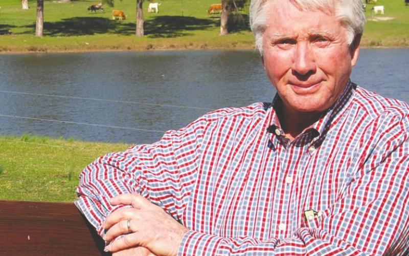 Tex McIver smiles when prompted, even though his eyes are still teary from a 2017 interview with The Eatonton Messenger, as he leans against the fence on his Pea Ridge Road ranch in Putnam County. McIver’s attorneys plan to seek bond after his conviction was overturned last week. LYNN HOBBS/File Photo