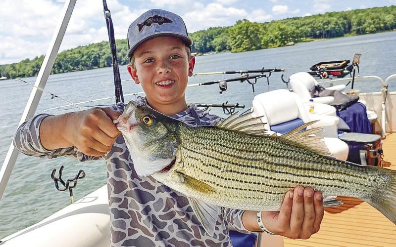 A fine young man and a fine striper on board Kevin Wahl's Wild Side Charters from last weekend. CONTRIBUTED