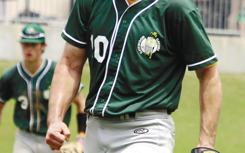 Wilson Moore (10) celebrates after striking out an opposing batter.