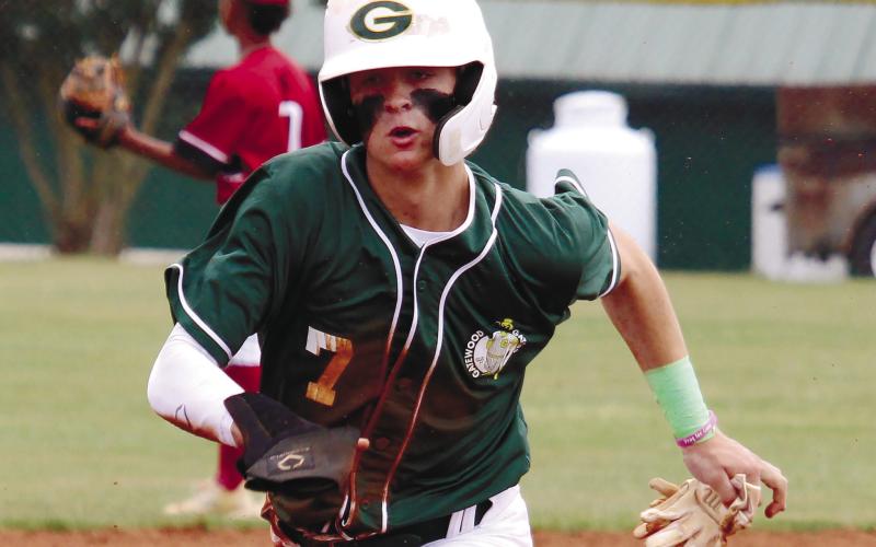 Ames Johnson (7) hustles around the base path.
