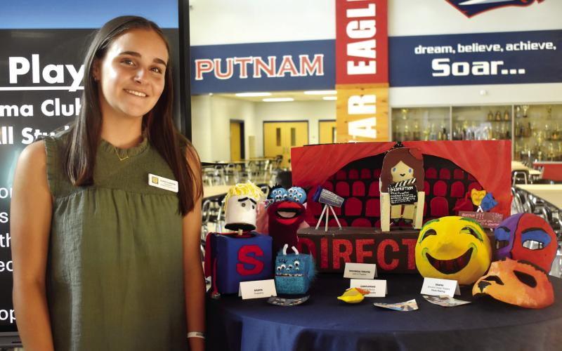 Musical Theater student Joelle Lukens shows off the hand-made projects created in the different Fine Art programs.