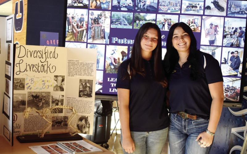 Future Farmers of America (FFA) members Maura Carmichael and Abby McLeroy hosted the table for FFA.