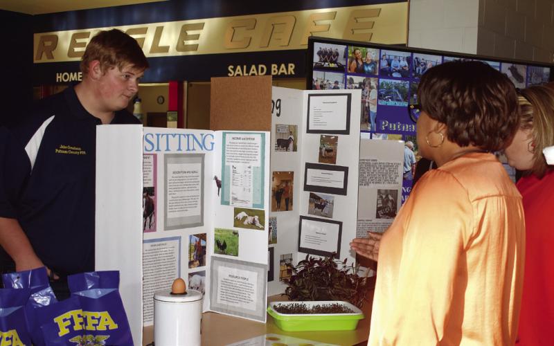 FFA member Jabe Gresham answered Board of Education member Doris Clemons and Assistant Superintendent Laura Melton’s questions.