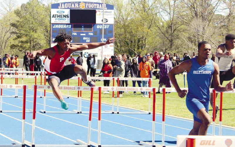 A Putnam hurdler competes at the region track meet. ARELLA CASH/Staff