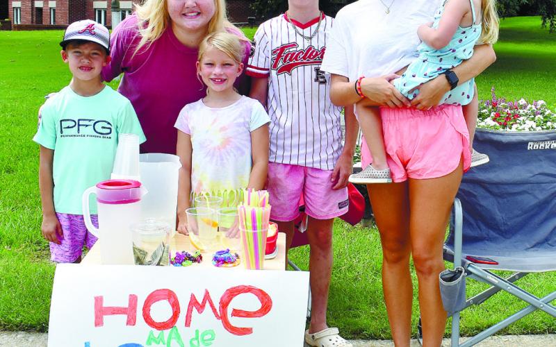 The group sold homemade lemonade and bracelets to people walking  by