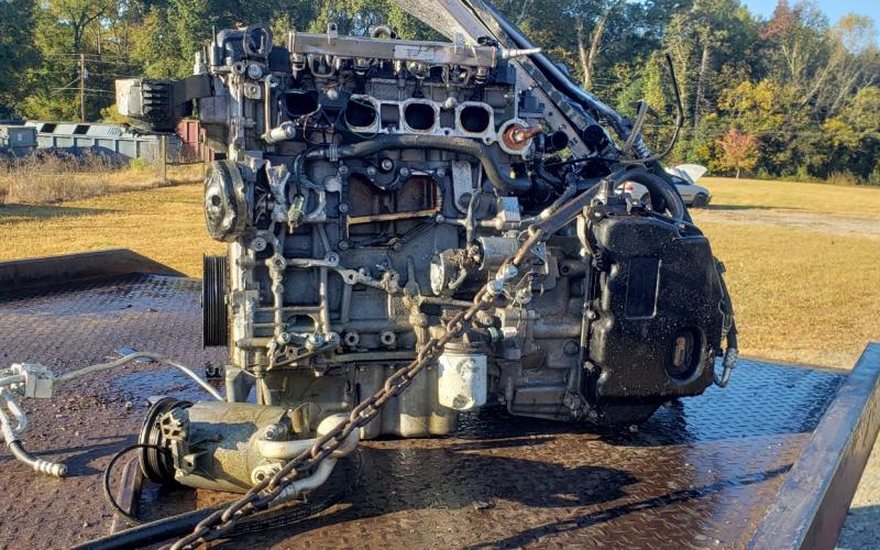 The motor of the Ford Escape sits atop a wrecker. The impact of the crash knocked the motor completely out of the vehicle. CONTRIBUTED