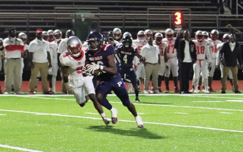 Brayon Farley (16) picks up extra yardage after a catch in a game against Laney on Friday, Oct. 28. ARELLA CASH/Staff