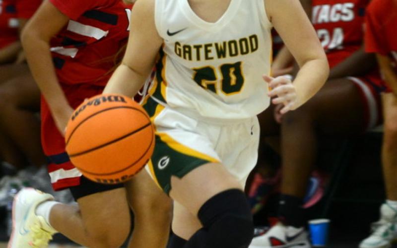 Gatewood junior Eliana Tkacik (20) pushes the ball up court in a game earlier this season. IAN TOCHER/Staff