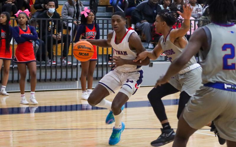 War Eagles’ guard Eren Banks (1) tries to use the baseline to his advantage during a Region 4-AA game against top-ranked Westside on Friday night. The senior finished with 23 points. LANCE McCURLEY/Staff
