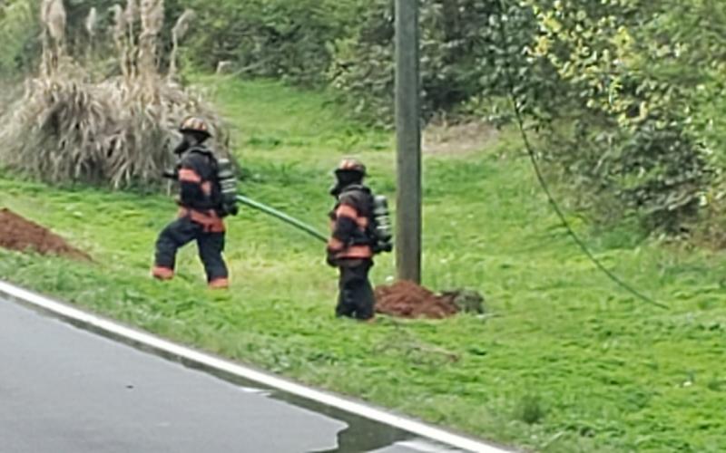 Eatonton Firefighters stand watch and ready as workers repair a gas line break.