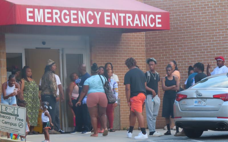 A crowd gathers outside of Putnam General Hospital where the shooting victim was being treated. (Contributed photo)