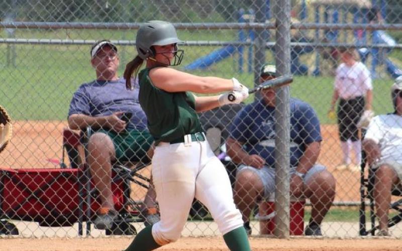 A Gatewood softball slaps a single into right field during a scrimmage game this summer. CONTRIBUTED