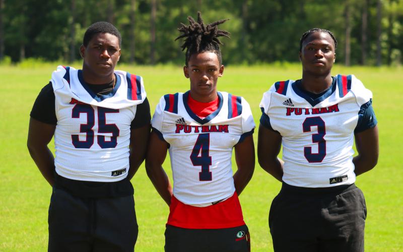 (L to R) Zacoree Wallace (35), Sharod White (4), and Rashod Daniel (3) look to be playmakers for the War Eagles in 2023. LANCE MCCURLEY/Staff