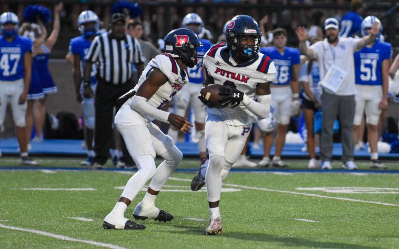 War Eagles’ defensive back Kavar Andrews (5) pursues Oconee’s Mac Little (12) while in coverage. LANCE MCCURLEY/Staff
