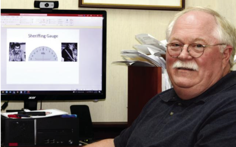 Putnam County Sheriff Howard Sills demonstrates his “Sheriffing Gauge” in his office at PCSO headquarters in Eatonton. IAN TOCHER/Staff