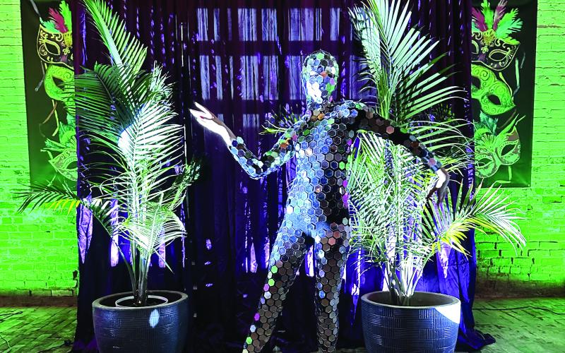 The Mirrored Dancer lit up the room with sparkles of light while dancing to the New Orleans party music.