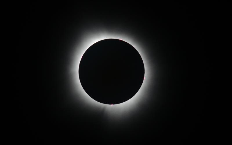The Sun and Moon line up perfectly during totality April 8 near Carbondale, Ill. The solar flares along the Sun’s perimeters are called prominences, which can extend as far as 60,000 miles from the surface of the Sun.