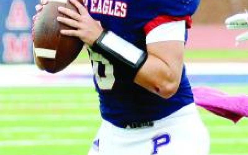 Putnam County quarterback Branan Griffin (8) drops back to pass in a loss to Social Circle. IAN TOCHER/Staff