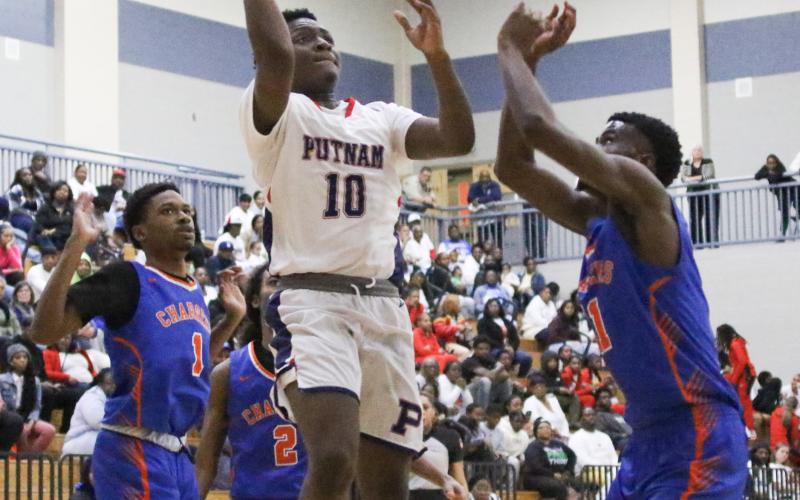 Junior Tamaud Woodson (10) was the top scorer for the War Eagles in a big 90-62 win over Central to open state playoffs last Wednesday at home in Putnam County. TREY NORRIS/Staff