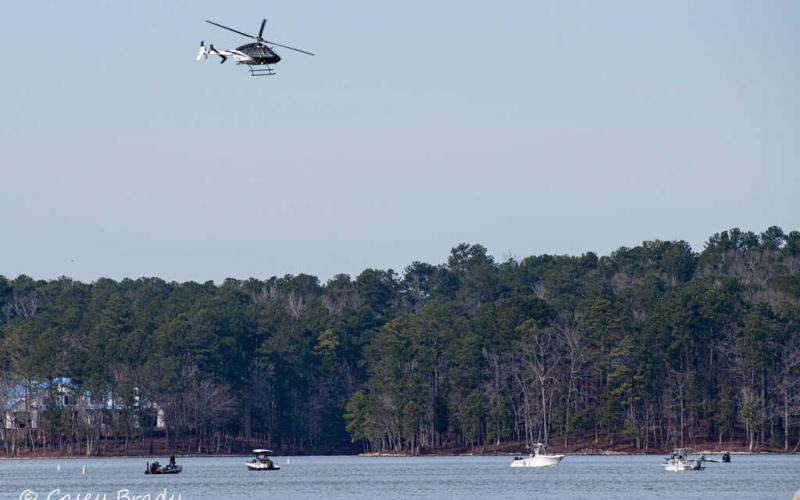 Law enforcement and rescuers search Lake Oconee for a boater who has been missing since Saturday. (Photo taken and contributed by Casey Brady)